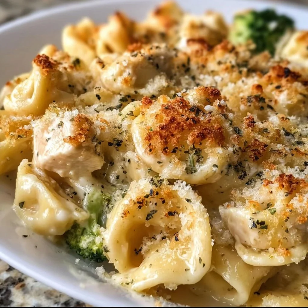 Delicious Chicken Alfredo Tortellini Bake garnished with parsley and served in a dish