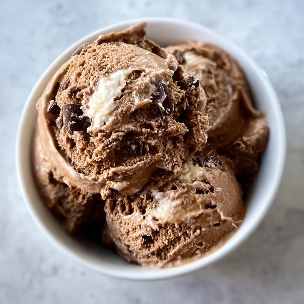 Chocolate Cottage Cheese Ice Cream in a bowl, topped with chocolate shavings.